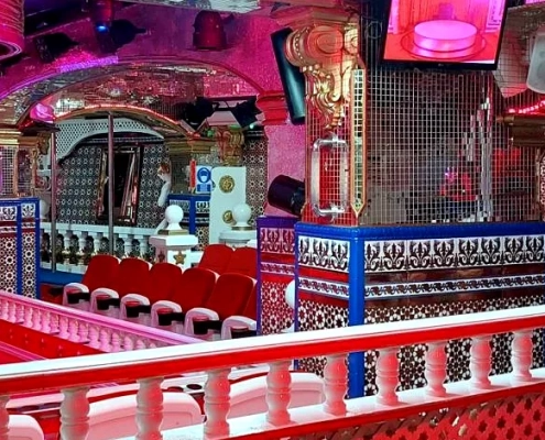Inside Bagdad Barcelona nightclub interior with seating and stage area view